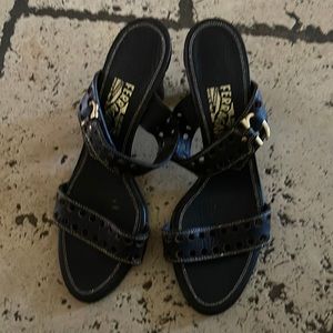 Fetragamo sandals in guc. They fit size 8-9 . The buckle is adjustable .